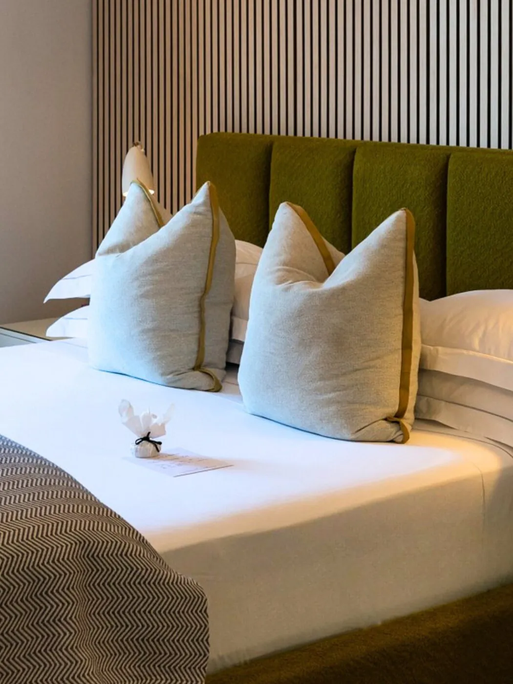 Handpicked linen and pillows on a Superior Room bed