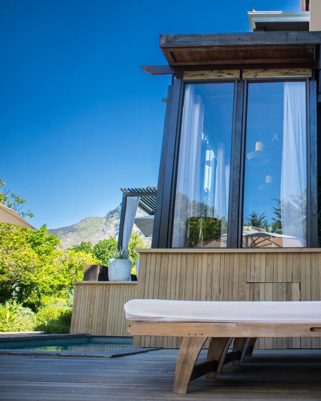 Glass-fronted suite and pool deck