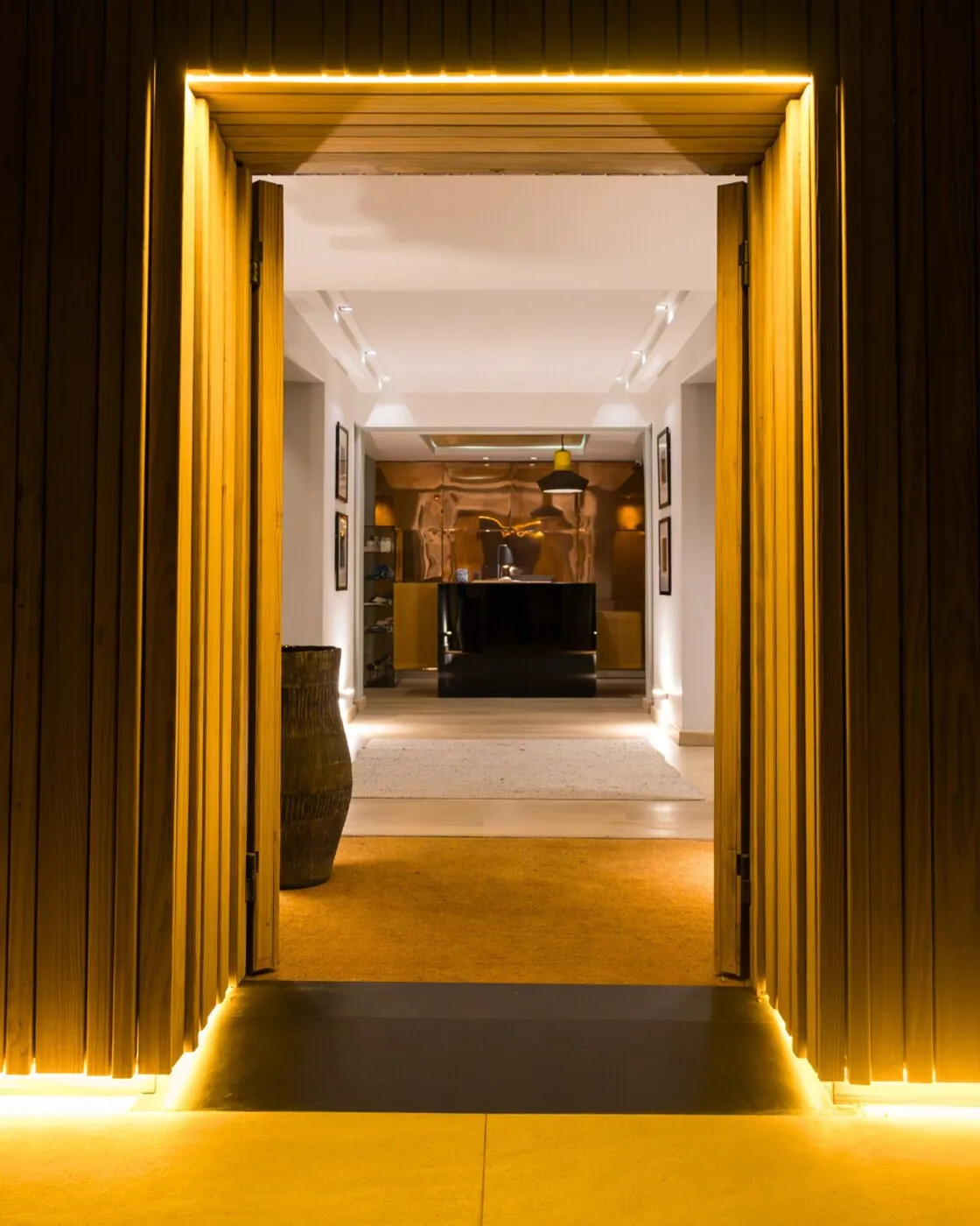 The entrance corridor, lit in gold