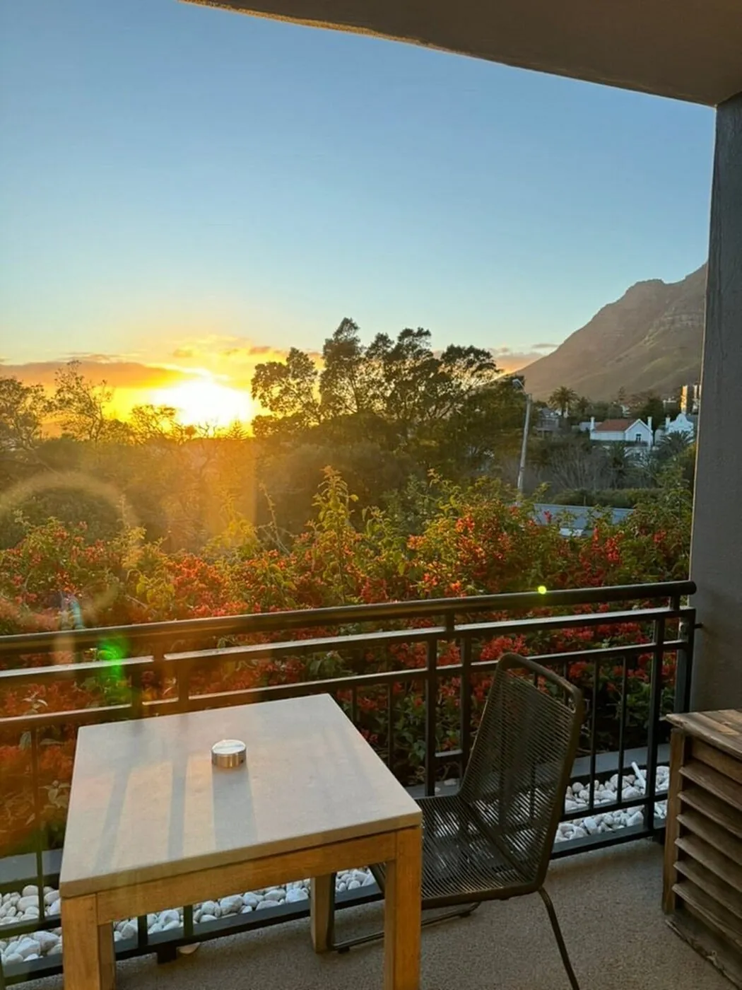 Sunset over the mountains from a Kensington Place balcony