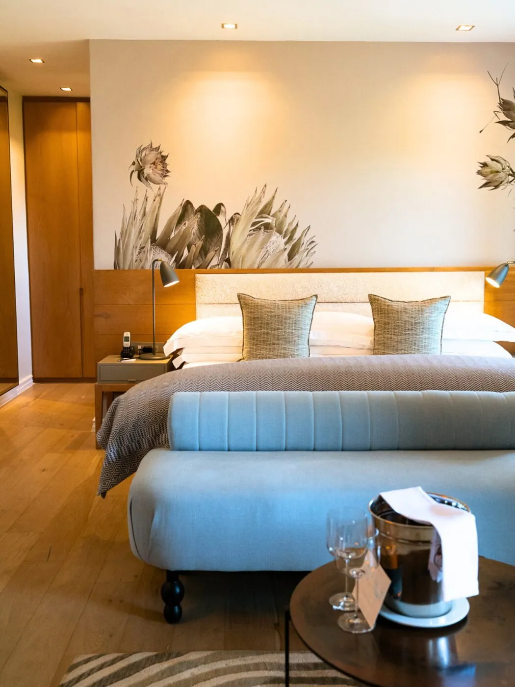 Superior Room at Kensington Place with king bed and floral mural