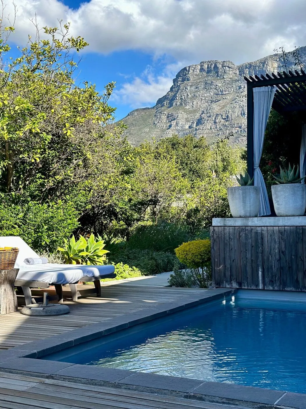 The pool terrace at Kensington Place, Table Mountain rising above