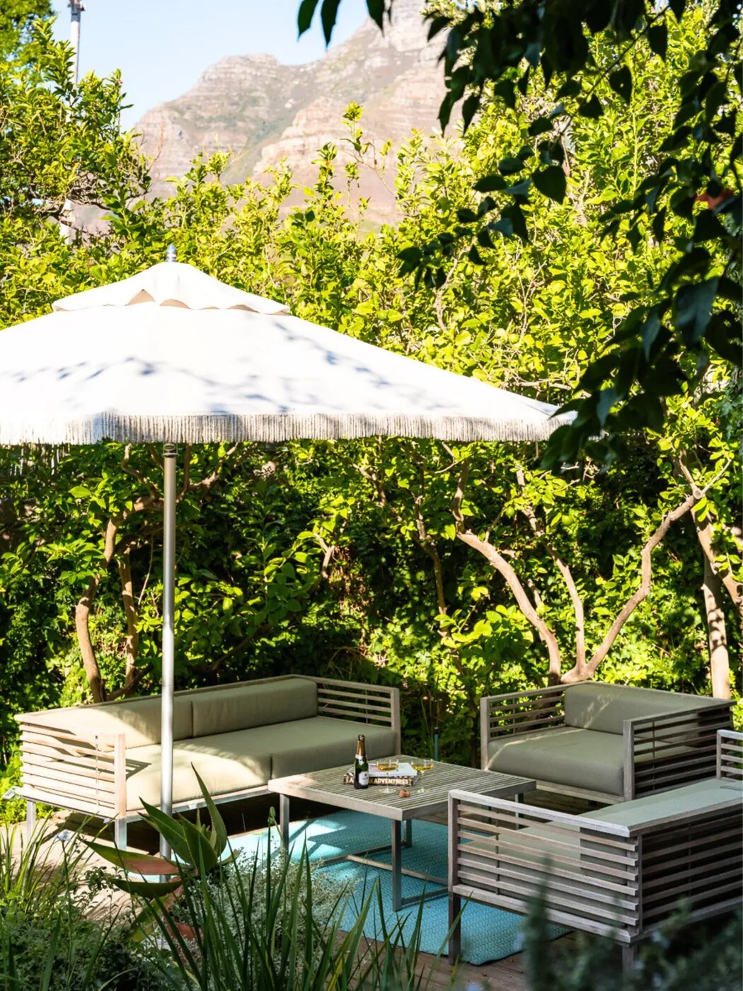 Garden loungers under an umbrella at Kensington Place